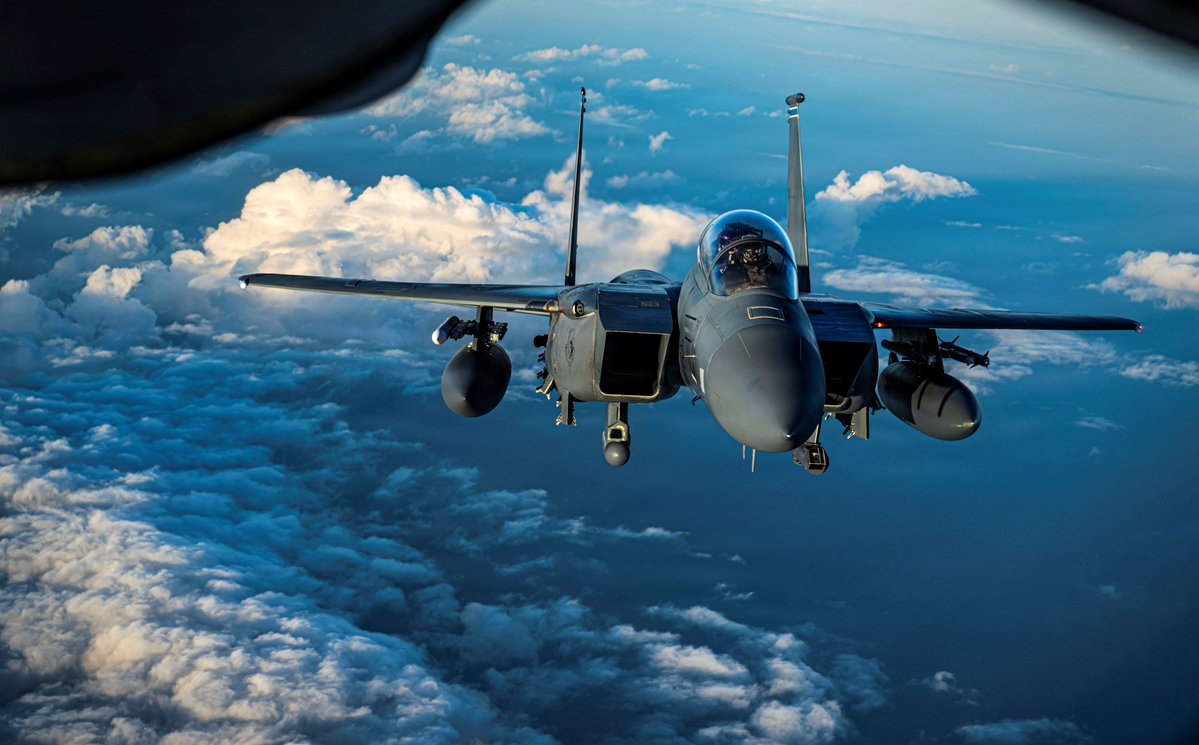 DeptofWar's tweet photo. A @usairforce F-15E Strike Eagle fighter jet deploys flares over the North Sea, extending the reach of combat airpower. https://t.co/kzGoe129qU