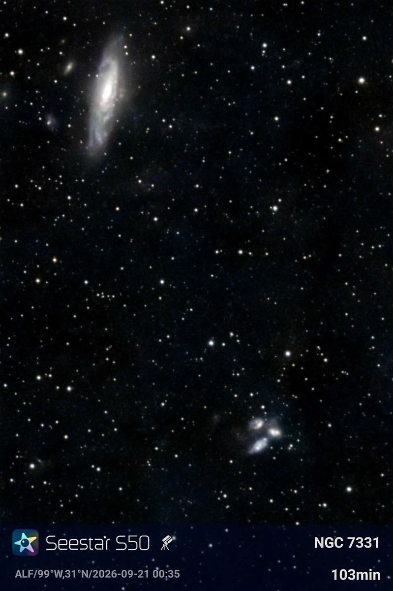 konstructivizm's tweet photo. Thirteen thousand megaparsecs sounds clinical. Call it forty-four million light-years and the picture changes: NGC 7331 is a city of stars the size of the Milky Way, hanging in Pegasus like a tilted shield.

It is Caldwell 30 — an unbarred spiral with a golden bulge, dust lanes that cut like scars, and arms still busy making stars. From our angle it looks uncannily like home seen from outside. No bar across the middle. Just a quiet, massive disk turning in the dark.

In the lower right of the same frame sits a traffic accident of galaxies: Stephan’s Quintet. Four of them are locked in a slow gravitational brawl hundreds of millions of light-years farther away. One interloper, NGC 7320, is much closer and only happens to share the line of sight. Together they look like a handful of sparks thrown against the spiral’s flank.

This field was shot and edited with a Seestar S50 — a small smart telescope catching two of the sky’s great characters in one frame: a twin of the Milky Way, and a compact group tearing itself apart beside it.