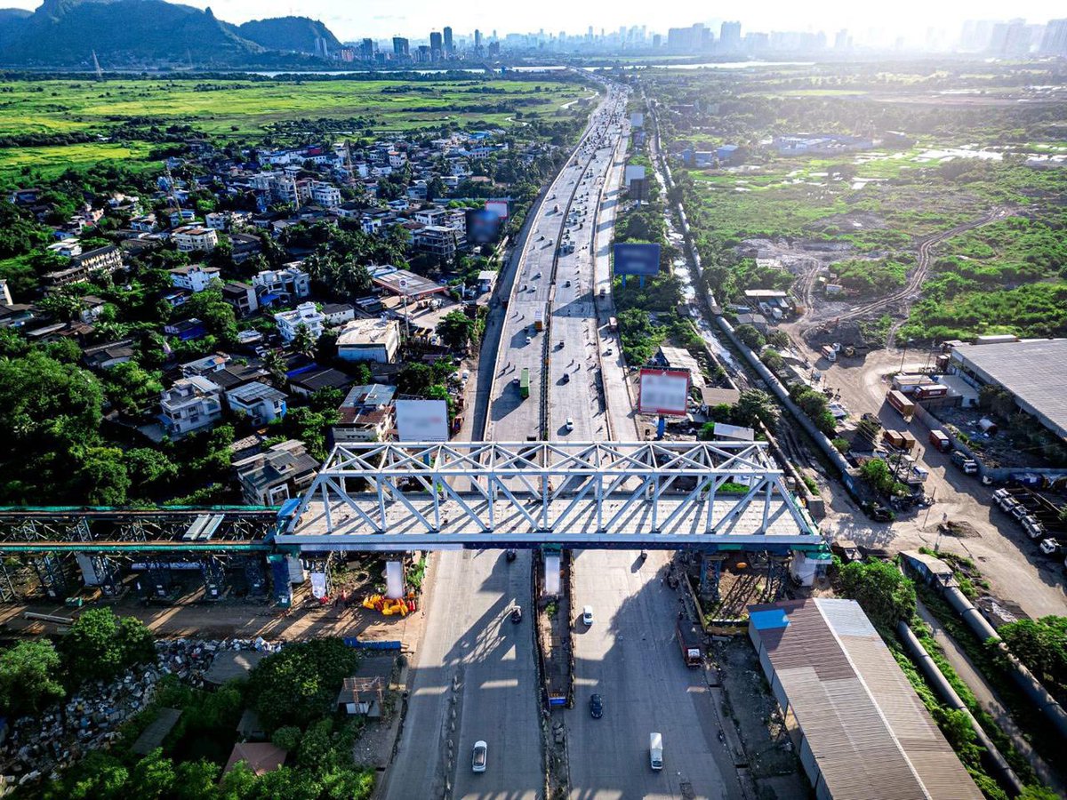 RailMinIndia's tweet photo. A landmark milestone for India’s Bullet Train Project! 🚄🇮🇳

A 100-metre, 1,405 MT steel bridge has been successfully launched over NH-3 at Dive-Anjur, Bhiwandi, the first steel bridge completed for the Mumbai–Ahmedabad Bullet Train Project in Maharashtra.
#BulletTrain https://t.co/U30bK9Hn40