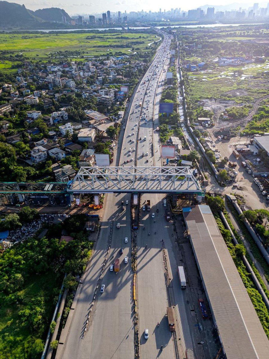 RailMinIndia's tweet photo. A landmark milestone for India’s Bullet Train Project! 🚄🇮🇳

A 100-metre, 1,405 MT steel bridge has been successfully launched over NH-3 at Dive-Anjur, Bhiwandi, the first steel bridge completed for the Mumbai–Ahmedabad Bullet Train Project in Maharashtra.
#BulletTrain https://t.co/U30bK9Hn40