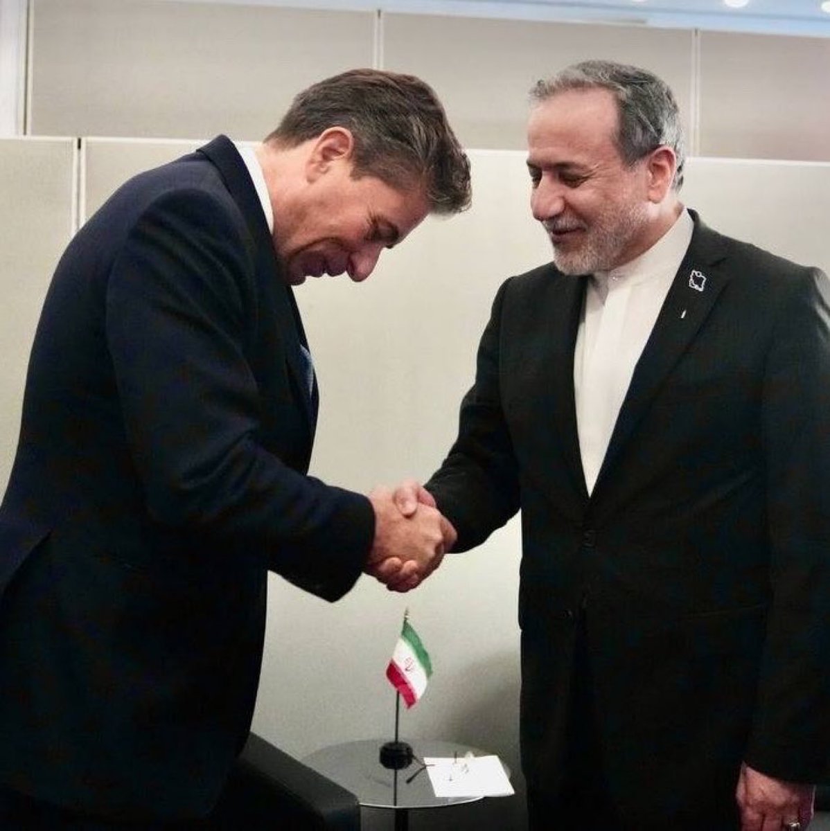 EylonALevy's tweet photo. The man on the left represents the UN. 

The man on the right still has the blood of tens of thousands of Iranian protesters on his hands. https://t.co/qo8JBjM0L1
