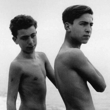 spankingmonkey3's tweet photo. Notice the quiet intensity that builds in the space between them. The ocean provides an endless backdrop, but the true story is happening entirely in the micro-expression of a turned head and a fixed, admiring gaze. https://t.co/to0g0x2BZa