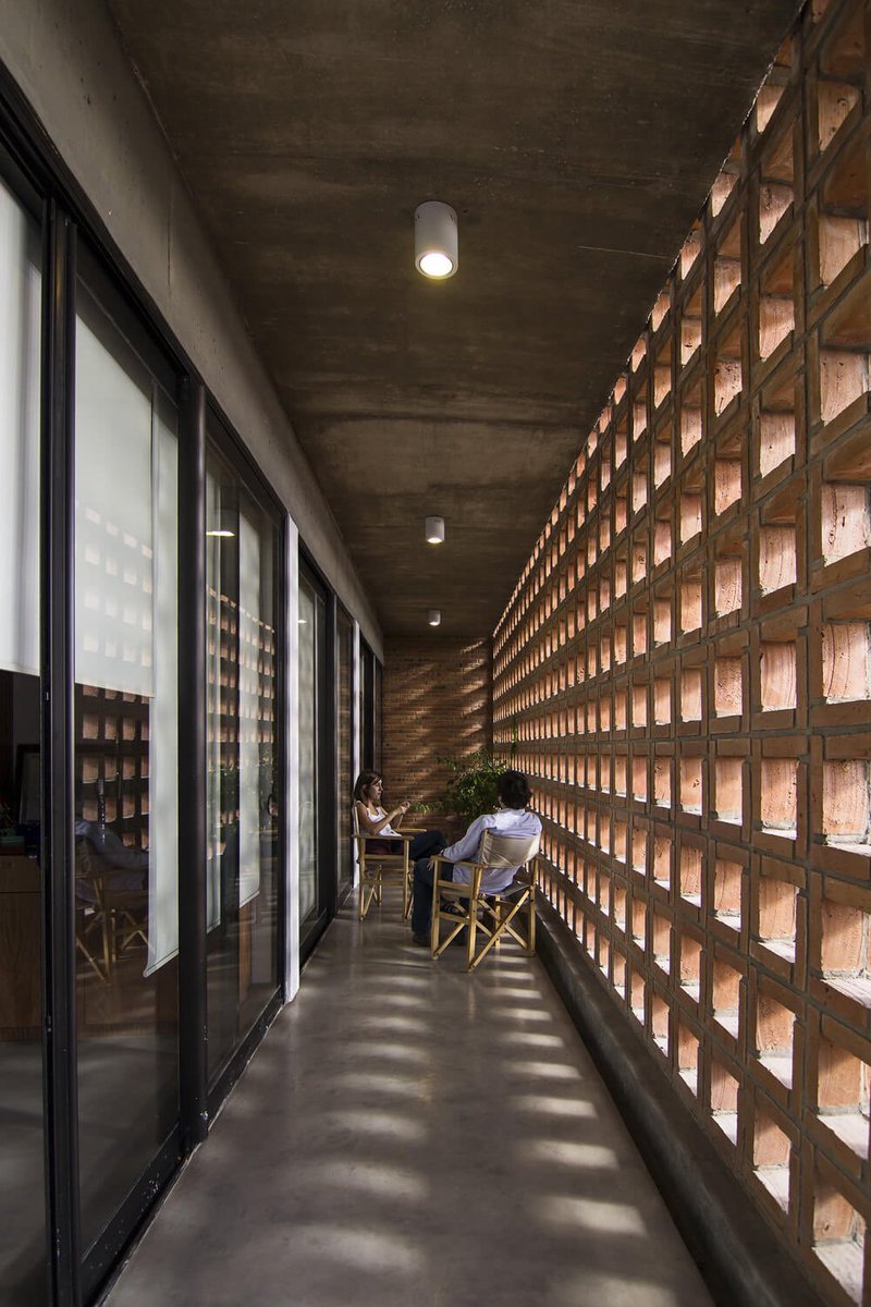 shavnyuyngah's tweet photo. Breeze blocks should be the default in our public buildings. Not because they look cool, but because they cut the running cost.

A wall that lets air through does part of the cooling for free, so the AC works less and the electricity bill drops. Public buildings run all day, so those savings add up fast.

This is the San Francisco Building in Asunción, Paraguay. It cost about $700 per square meter and reuses rainwater for its gardens and sanitary use. Breathing walls, recycled water, and a sane budget.

Kéré is doing it in Dakar. Others are doing it in Paraguay. We keep sealing our public spaces in glass.

Asunción, Paraguay. Architect: José Cubilla. Completed 2014. Photography: Lauro Rocha.