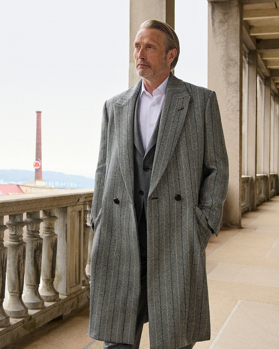 Zegna's tweet photo. TAILORED WITH PRECISION​

Mads Mikkelsen wears ZEGNA's Autumn 2026 collection against the backdrop of the Lanificio in Oasi Zegna.
#ZEGNAAUTUMN26 https://t.co/fVCXTl3Ezt