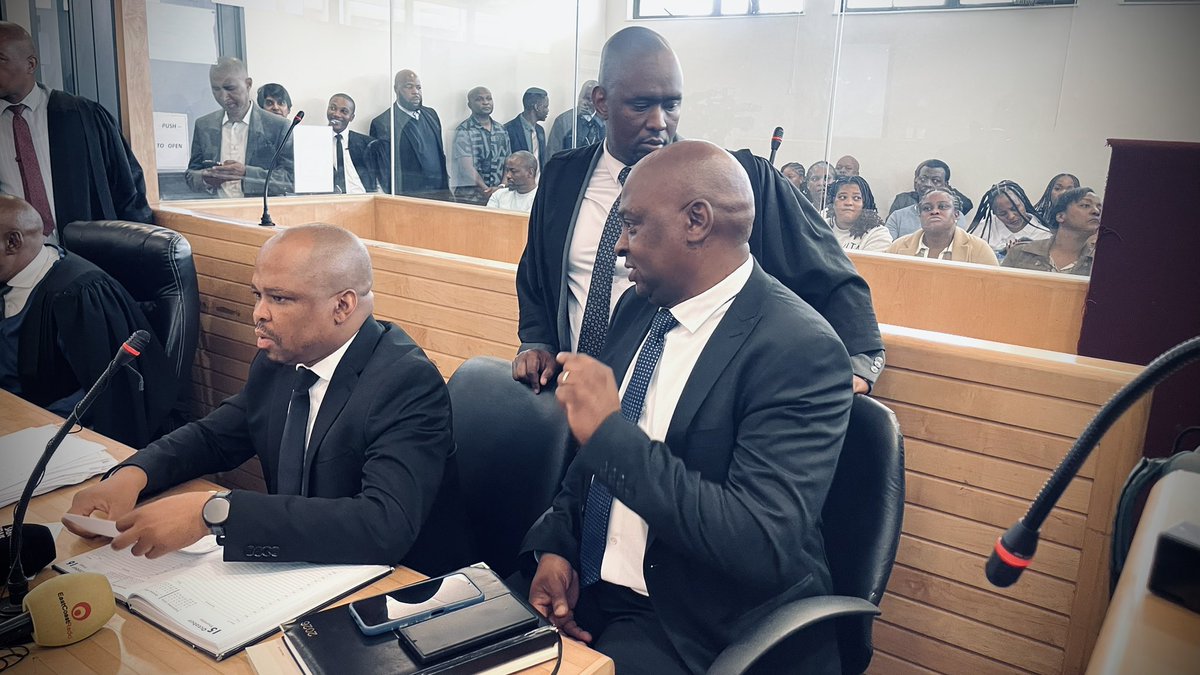 DasenThathiah's tweet photo. Colonel Ntate Khumalo - seen here speaking to Lt-Col Malcolm Fynn of the PKTT - was also at court with his team. 

The investigation into the murders of Nel and Khuzwayo, and the theft of CI funds, is being handled by GCI-Ops. 

They are working closely with respected senior state prosecutors Adv Elvis Gcweka and Adv Lawrence Gcaba. 

@eNCA