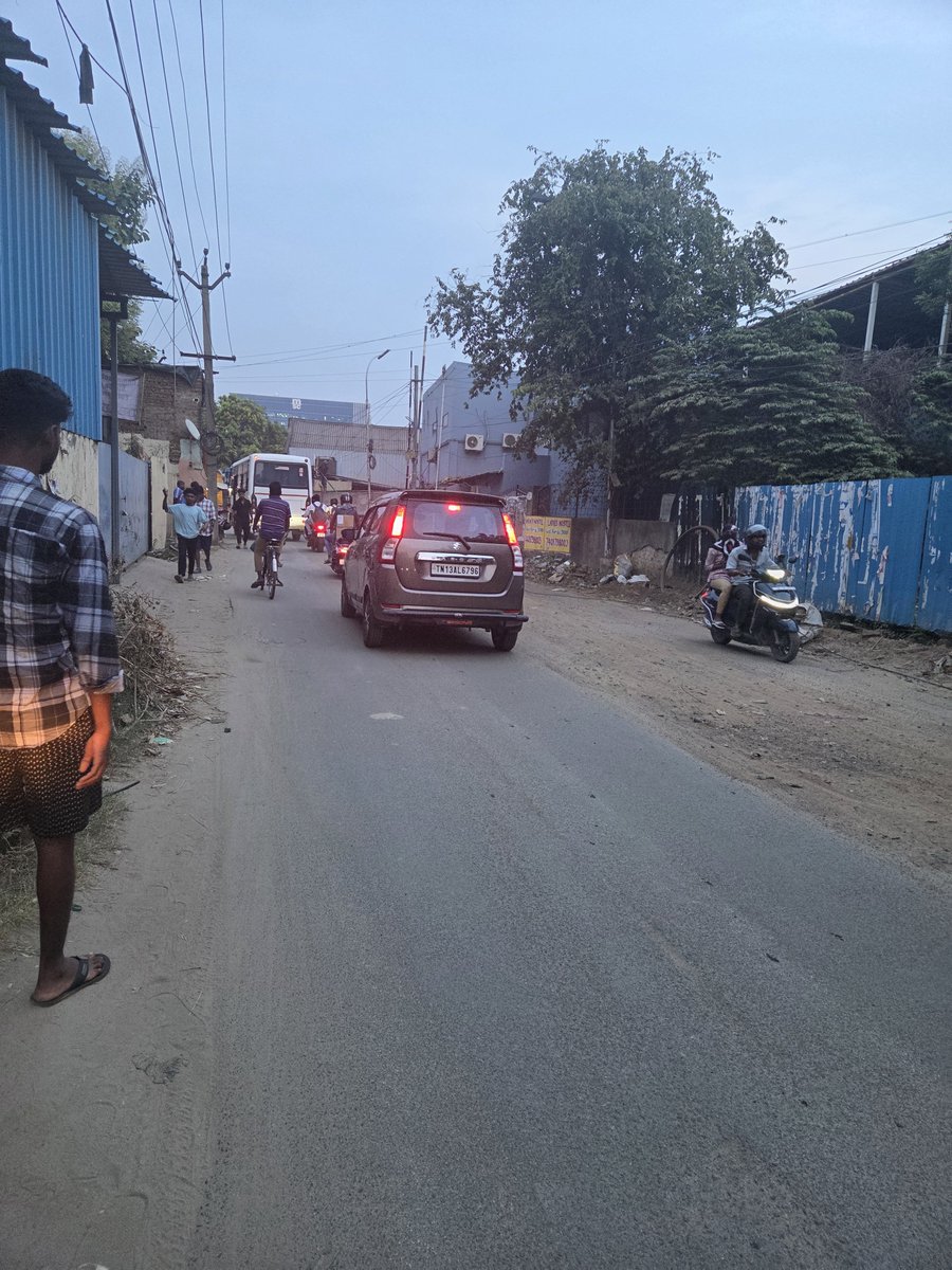 SudsG5's tweet photo. This is not a tier 2 or 3 town, this is not even some distant far flung suburb. 

This is Ambattur industrial estate, it generates employment for 200,000 people. Has an annual turn over of ₹  15,000 crore of which ₹ 3,500 cr is exports. 

It generates income taxes, CGST, SGST, excise and duties. It's support ecosystem (truckers, cleaners, security staff etc) must run into the 10's of thousands. 

It's also an emerging residential real estate hub. The avg per sq in a newer condo is ₹7,500 / 8,000. 

Yet it looks like a war torn dystopia. Has ZERO pavements though 10's of thousands of workers walk from railway stations / bus stops to their factori s and back. 

Large parts of it lack functioning street lights. 

Filthy open sewers, even spotted a few fat pigs in them, cattle, stray dogs, dust everywhere, garbage garbage garbage as far as the eye can see.