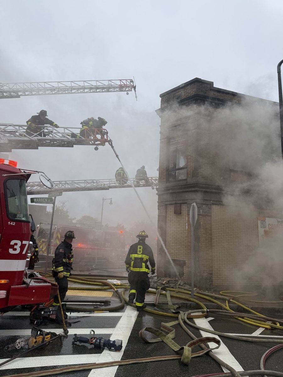 BostonFire's tweet photo. All fire companies are still working hard to keep water on the building . Engines are pulling water from as far as Moreland St, 2 blocks away. Please avoid Nubian Sq. area. Thousands of feet of feeder CC has most side streets blocked. https://t.co/Gs8iEi4uAN