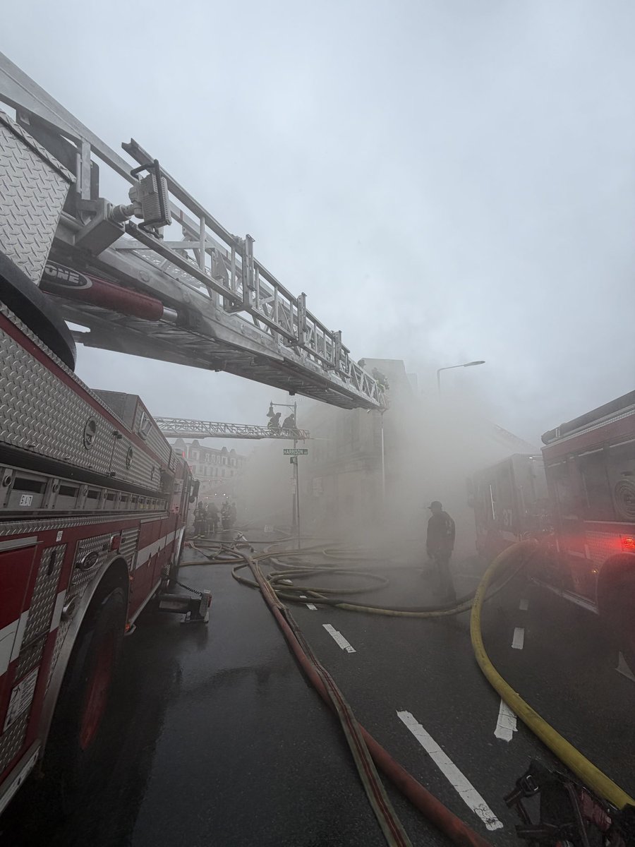 BostonFire's tweet photo. All fire companies are still working hard to keep water on the building . Engines are pulling water from as far as Moreland St, 2 blocks away. Please avoid Nubian Sq. area. Thousands of feet of feeder CC has most side streets blocked. https://t.co/Gs8iEi4uAN