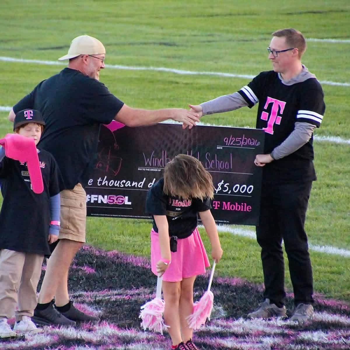OhioTate's tweet photo. The Windham Bombers (tiny school district in Ohio, they literally had 7 girls in the entire senior class when I coached there) have a chance to do something special for their small town, big heart community.

They hosted @TMobile for their Homecoming Game last Friday and went all in to show their appreciation for $5000, which could become a MILLION for a new field & track if they win.

That’s the Head Coach painting the middle of the field before the game. It takes a village!!

If you can, please tag
@TMobile and use the hashtags #FN5GL #Entry to help a great group of people out!! #WindhamFamily