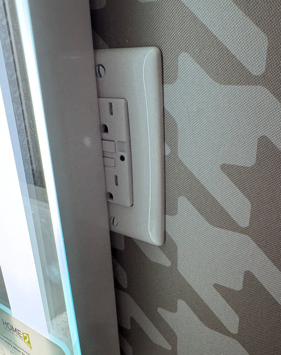The_Holocron's tweet photo. So, @Hilton , it would have been nice to have one outlet in the bathroom area. How exactly did this hotel get a Certificate of Occupancy from the local building officials? https://t.co/JQ5DnFdUeH
