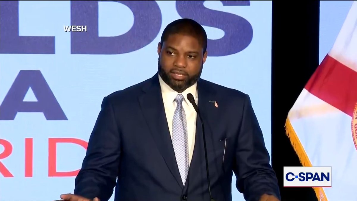 A man in a dark suit and light tie speaks at a podium, with a C-SPAN logo visible in the bottom right and a Florida flag partially shown. The image relates to the post by featuring Rep. Byron Donalds, a Florida congressman who is being quoted in the accompanying statement about children's rights regarding irreversible medical decisions.