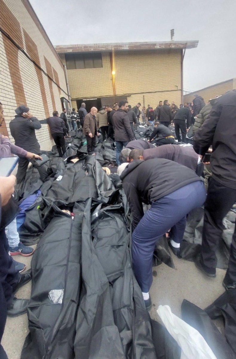AramBafeghi's tweet photo. These black body bags hold the sons and daughters of Iran.
Fathers, mothers, brothers, sisters gunned down by regime in the January 2026 massacre.

Thousands of lives extinguished in cold blood so a dictatorship could cling to power.
#IranMassacre‌2026 https://t.co/Act1rSUtqv
