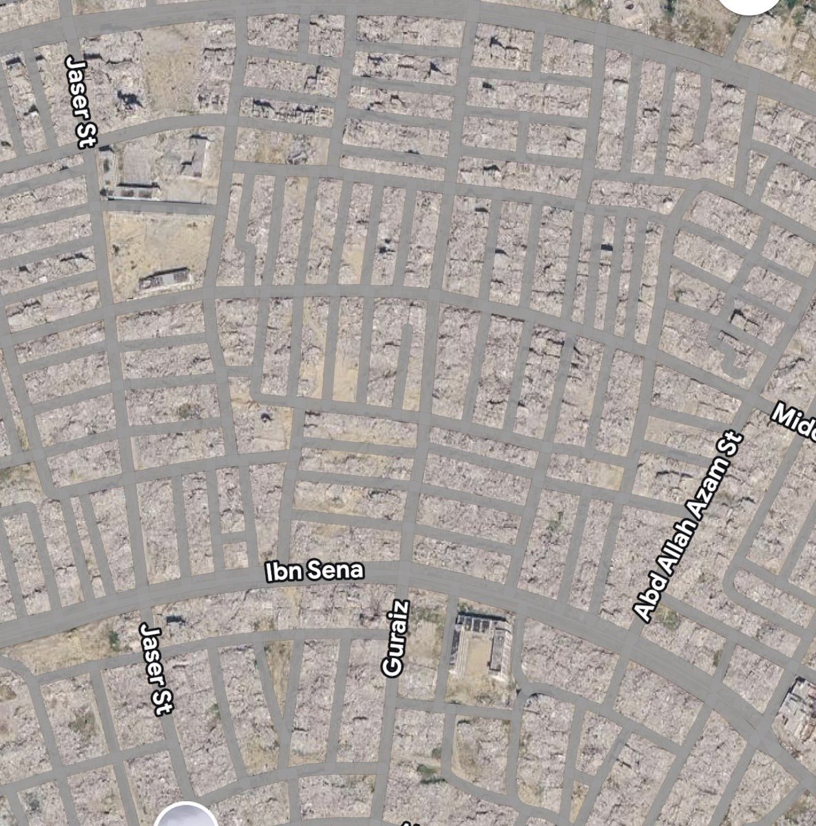 MosabAbuToha's tweet photo. For me, as a Palestinian from Gaza who survived the ongoing genocide, when I look at the rubble of homes on Google Maps, I am not seeing only the remains of buildings, which from far look like a decaying wall.

I am seeing the remains of people whose bodies were crushed beneath walls and ceilings they painted with their own hands.

I see children’s toys. Books. Backpacks. Coloring pencils. An unfinished meal. Blankets. Shoes. Photo frames of grandparents whose grandchildren never met. An old key to a home in Yaffa or Haifa.
I can also hear the last words of a broadcaster on the radio before the news occurred, before the radio was broken and the family crushed.
No breaking news there. No news at all.