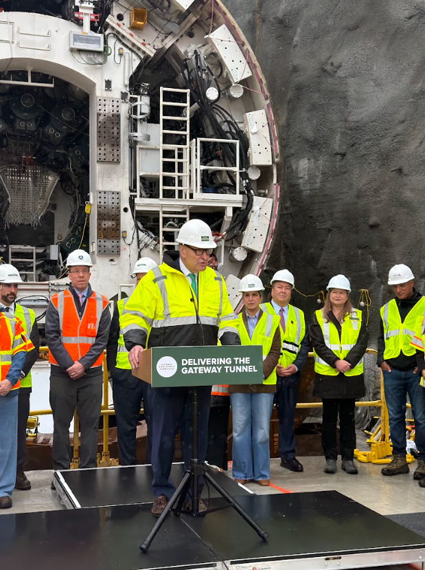 SenSchumer's tweet photo. Gateway is ALL SYSTEMS GO!

After repeatedly beating Donald Trump in his attempts to shut off federal funding for Gateway, we finally began boring the Hudson River Tunnel, the first new tunnel under the Hudson in over 100 years.

I've championed this project for over a decade, secured billions in federal funding for it, and can’t wait to see it improve the lives of millions of commuters in the NY/NJ area.

It was an honor to join @GovKathyHochul, @GovSherrillNJ, @SenBooker, members of the Gateway Development Commission, and union leaders to mark this momentous occasion.