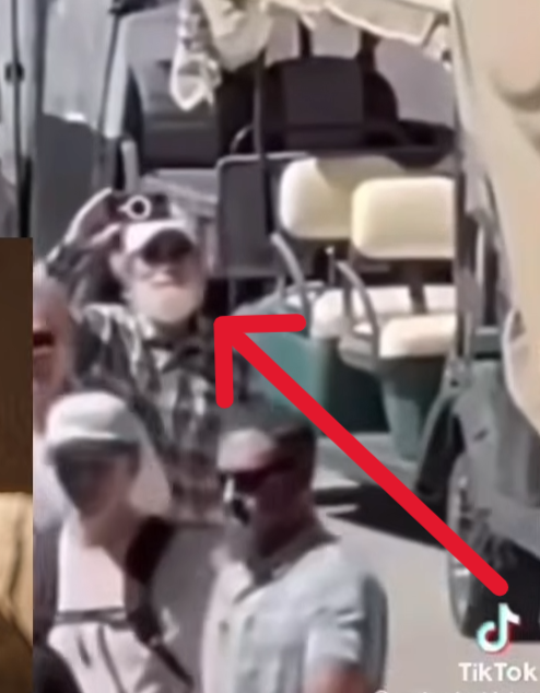 AlexandriaMcCue's tweet photo. The visual anomalies carry right over into the hands when you track the footage closely and in slow motion. Look at the red box with the blue arrows. The hand geometry is a completely distorted, dark gray mass. It doesn't quite mimic human biology. They were clearly operating under an unexpected time crunch because the plan did not go as expected. The rush job shows.

To be perfectly clear, the real Butch Shady was actually on-site the entire time. There's no debating his physical presence. But he doesn't have an unrendered digital void for a face or glitched gray geometric masses for hands.

The mechanism here is clever but sloppy. They used the real Butch walking around after Charlie was taken down as a baseline narrative shield to make us assume the figure at the perimeter was also him. But physical geometry and rushed pixels don’t lie, no matter how much digital paint they throw over the timeline under pressure.

They needed Erika scrubbed from that specific perimeter narrative, but they left the digital receipts all over the footage.