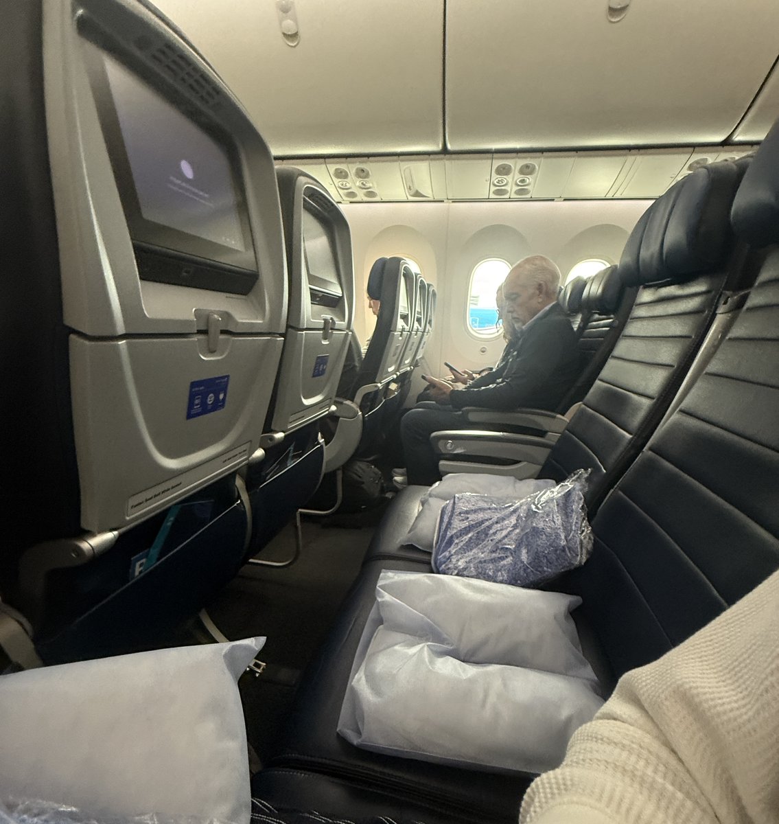 cdngdev's tweet photo. instinct checked me in to the most likely seat to get an entire free row on my 11 hour flight. actually the goat https://t.co/d9vbgl6p0b