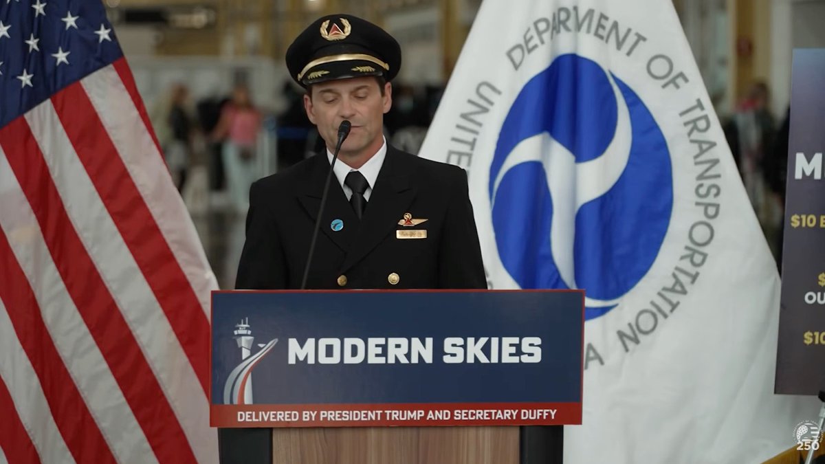 A photograph of a uniformed airline pilot speaking at a podium labeled 'MODERN SKIES - DELIVERED BY PRESIDENT TRUMP AND SECRETARY DUFFY', with US and Department of Transportation flags in the background.
