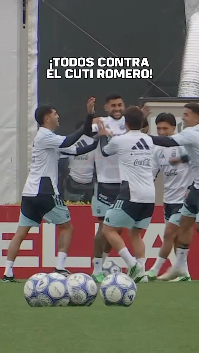 Soccer players in white and black Adidas training gear celebrate on a field, with overlaid text reading '¡TODOS CONTRA EL CUTI ROMERO!' and several soccer balls visible in the foreground.