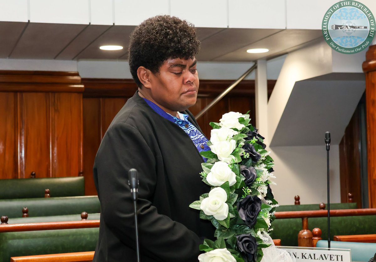 fijiparliament's tweet photo. Ministry of Agriculture, Waterways and Sugar Industry staff paid tribute to their late Assistant Minister Hon. Inosi Kuridrani who passed away over the weekend. They draped his seat in Parliament with black cloth and a wreath. https://t.co/iq0MKOs0YY