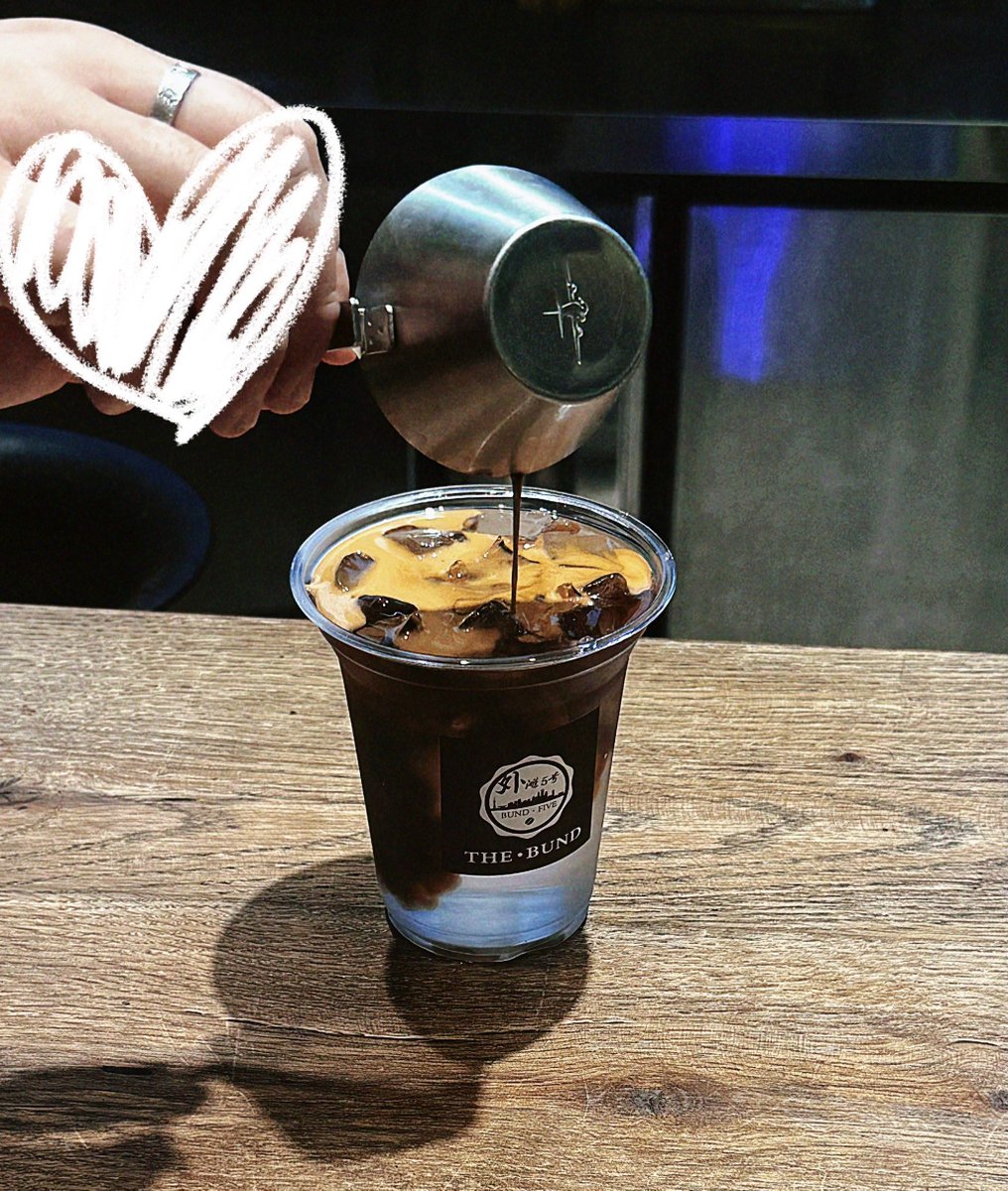 GriceldaKaqnof's tweet photo. Random city afternoon: a barista laughing while handing over iced coffee, sun glinting off the paper cup, passersby hurrying by in the background. https://t.co/R8pLpDzpgU