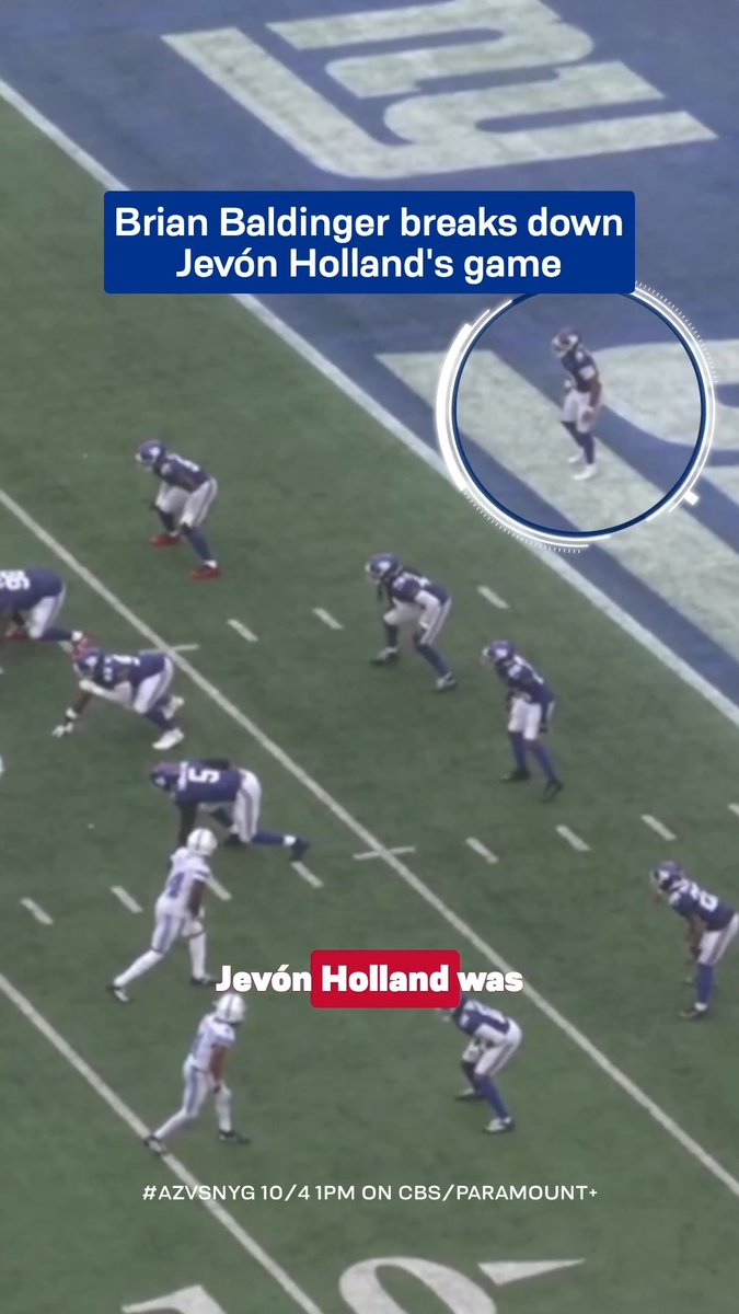 A still from a Giants vs. Cardinals NFL game shows players lined up on the field, with text overlay reading "Brian Baldinger breaks down Jevón Holland's game" and "Jevón Holland was," along with "#AZVSNYG 10/4 1PM ON CBS/PARAMOUNT+" promoting an upcoming broadcast. The image aligns with the post by previewing Brian Baldinger's breakdown analysis of Jevón Holland's impactful plays ahead of the Cardinals-Giants matchup.
