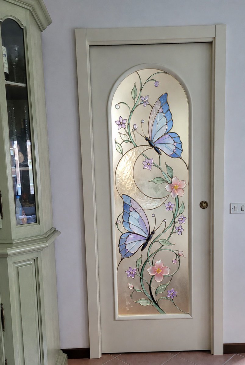 insperarise's tweet photo. butterfly stained glass door 🦋 https://t.co/vbmMpREdIG