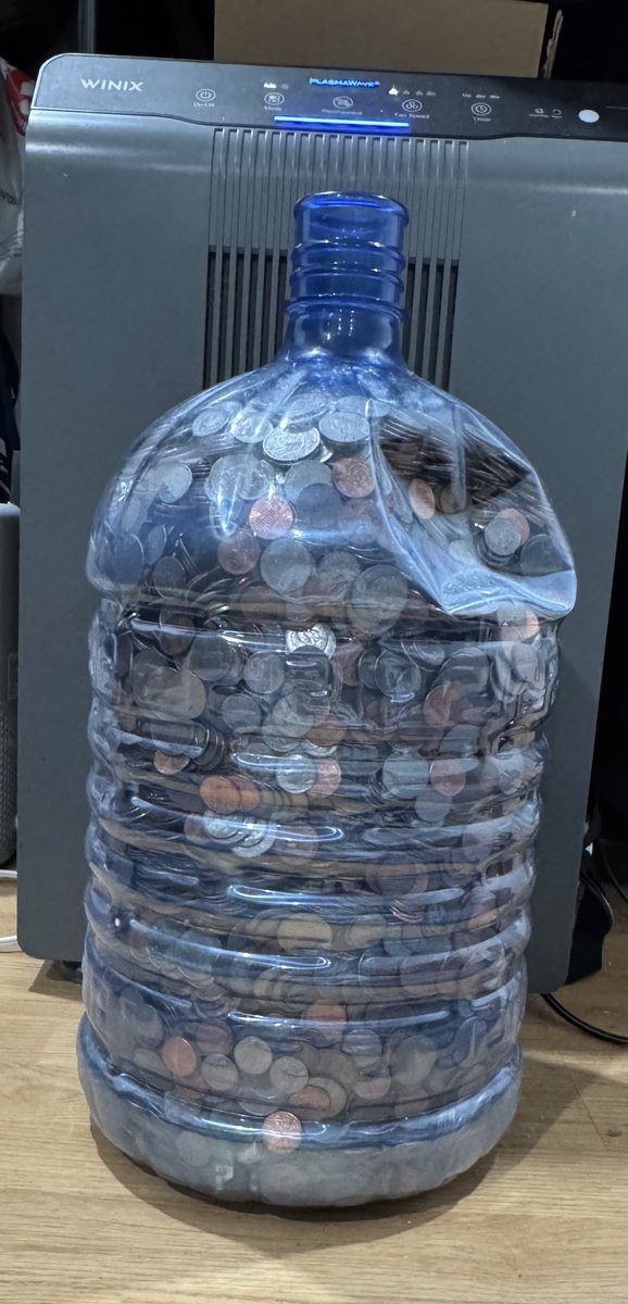 Syl_Stormrider's tweet photo. I have been saving change for over a decade, and finally filled this giant 5 gallon water bottle, my 28 yr old son can't even lift it its so heavy and he can pick me up like a sack of flour. Any guesses how much is in this bottle? https://t.co/9U0ctc1prW