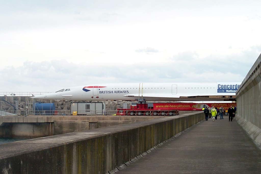 UKBorderWatch's tweet photo. Concorde sailed-then crossed muddy farmland.

In April 2004, British Airways Concorde G-BOAA was not upgraded to fly, so specialists dismantled it for barge transport to East Fortune, near Edinburgh.

Army engineers laid 2,500 panels across farmland; without that 1.7km track, the transporter could not reach the museum.