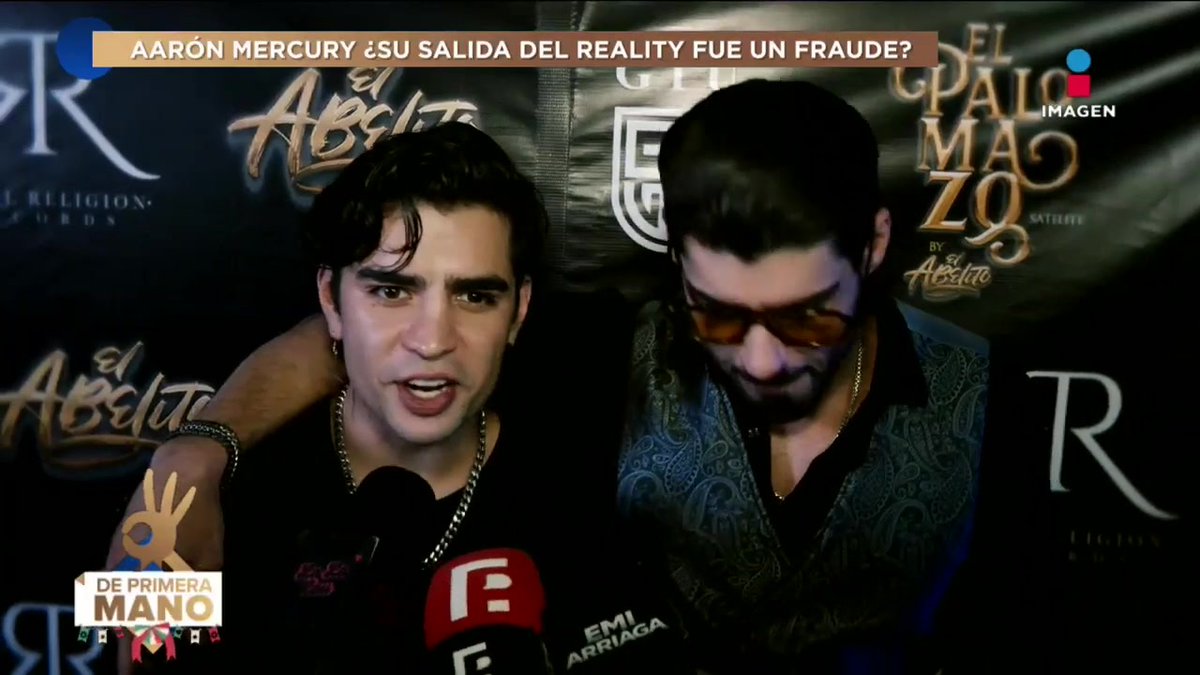 A news broadcast screenshot from 'De Primera Mano' (Imagen) with a headline 'AARÓN MERCURY ¿SU SALIDA DEL REALITY FUE UN FRAUDE?' showing a man speaking into a microphone alongside another person wearing sunglasses.