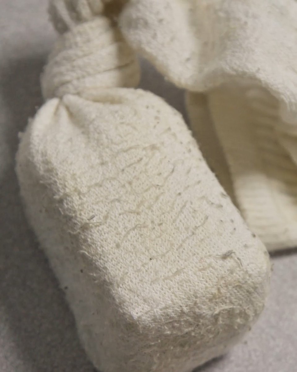 A close-up shows a pair of crude, white cloth or fabric-wrapped objects—possibly homemade weapons discovered during the jail shakedown mentioned in the post. The rough, handmade appearance of the bundle ties directly to the "#120HoursBehindBars" Discovery show's focus on contraband found inside correctional facilities.
