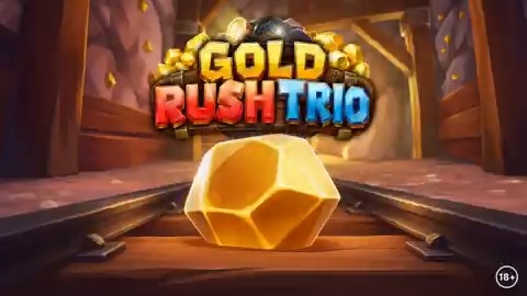 Promotional graphic for 'GOLD RUSH TRIO' featuring a large faceted gold nugget on wooden tracks in a mine setting, with an '18+' age rating.
