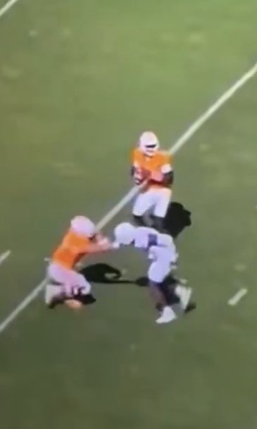 TubinTexas's tweet photo. @BigOrangeHeupel @SECOfficiating Lmao! You really getting upset over an AI photo? Let's talk about Simmons getting his helmet pulled off the play before your garbage time td😄 https://t.co/ns1BKEBU9M