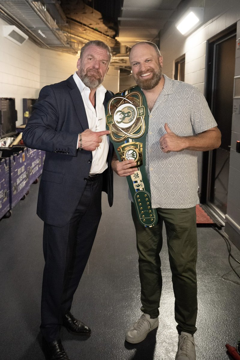 TripleH's tweet photo. Great seeing Coach Jenkins tonight before #WWERaw. Thanks for letting us have the @FiservForum before the season starts! @Bucks https://t.co/OJwXUTpepw