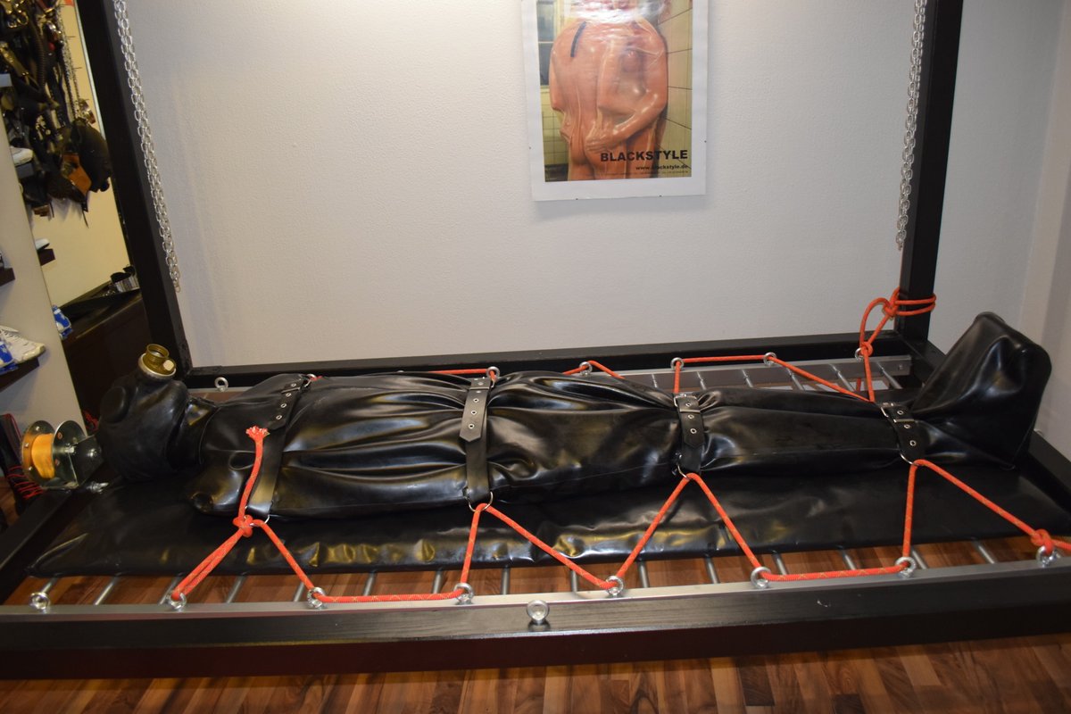 rubbrslave's tweet photo. Sleepsack on the frame. Gasmask on. Master stores it here until the next session. https://t.co/6L3uAkCqLk