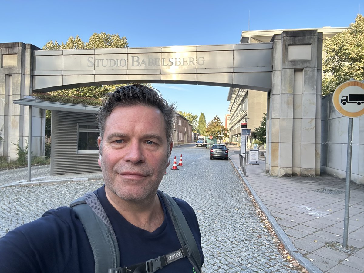 maartenverwaest's tweet photo. Standing beneath the @SBabelsberg arch this morning, thinking about Metropolis.

Fritz Lang and Thea von Harbou’s monumental film was shot at this very place and exactly a century ago. Released in 1927, it helped define modern science fiction by asking what happens when human lives become entangled with machines. More relevant than ever before, isn't it?

This afternoon at #MTHCON26, I’ll be taking the AI Garden stage, talking about From Set to Edit: What AI Should and Should Not Automate.

Unpopular POV: let AI take on the work that drains energy, from offload to a reliable pre-cut and anything in between, but storytelling, cinematography and editing are acts of human judgement. Machines may help you finding and sorting a bunch of material fragments, beyond human scale, but they should not decide what it means. Voilà. #NoAI

📍 AI Garden, Studio Babelsberg
🕐 Today, 13:00–13:30
More info 👇