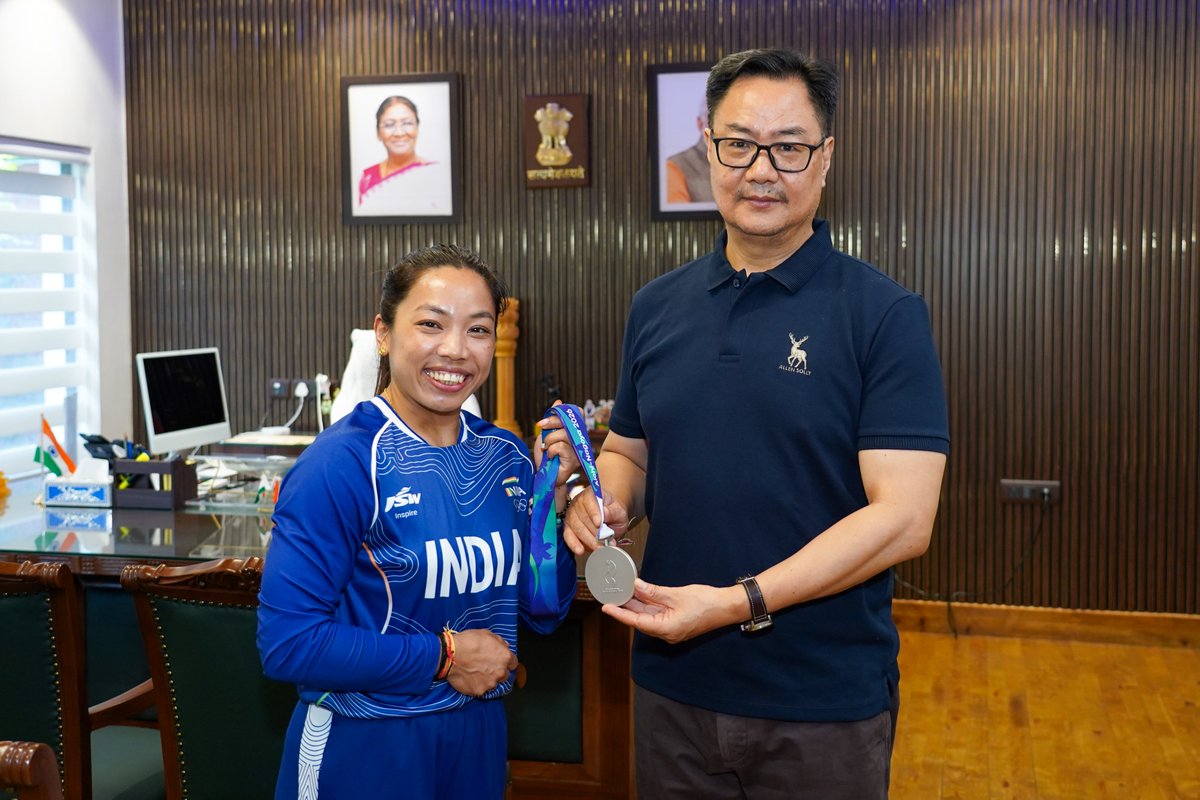 KirenRijiju's tweet photo. Warm welcome to @mirabai_chanu who has returned with a Medal from #AsiaGames2026 at Aichi-Nagoya, Japan. I congratulate her coach Vijay ji also. #Cheer4Bharat 🇮🇳 https://t.co/pLMngKM3N1