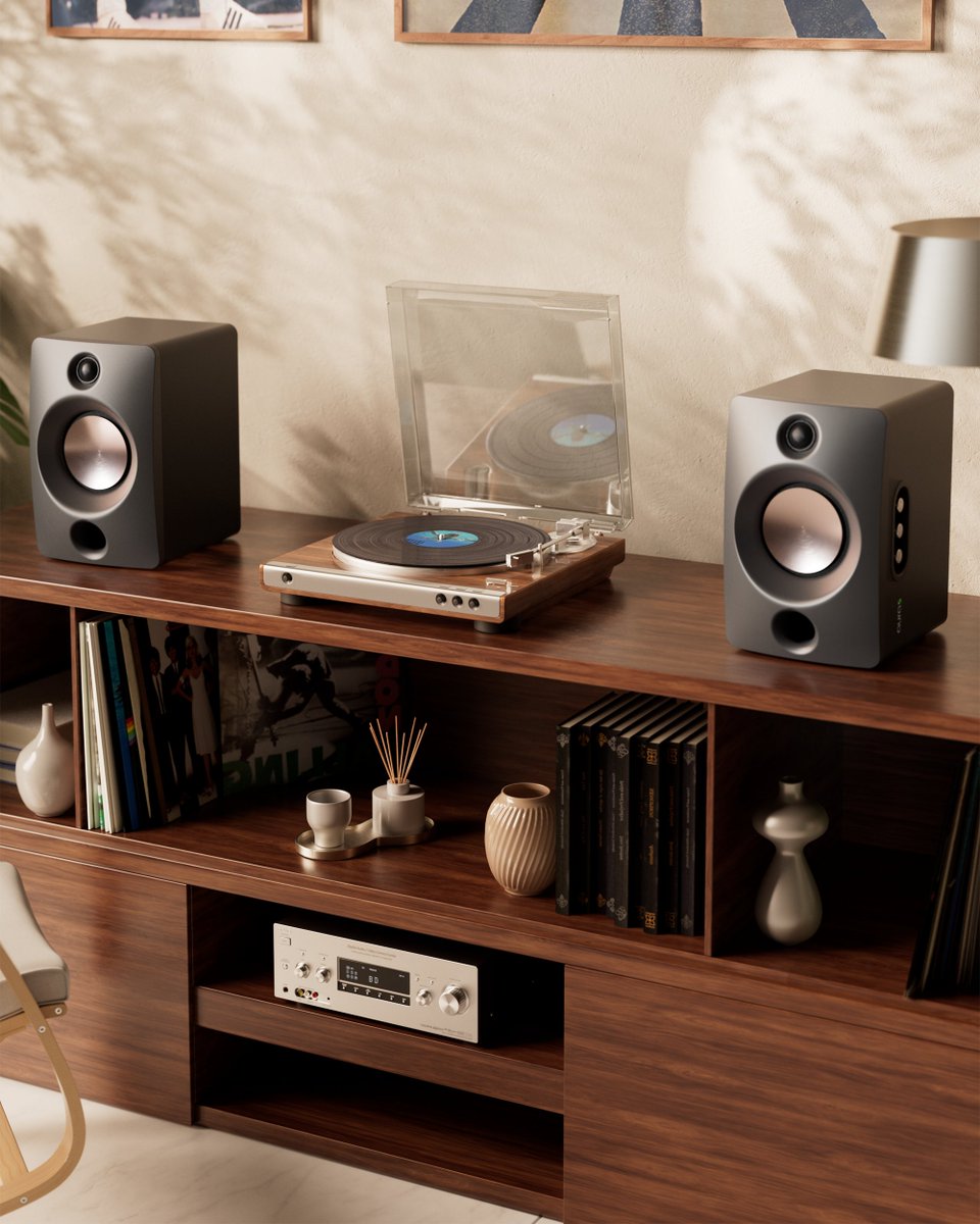 LumioIN's tweet photo. Most "home audio" today is a soundbar. One box, pretending to be stereo.
Lumio Aura 5 is the real thing. Two speakers. Wooden cabinets. Proper Hi-Fi sound. And a setup that takes about two minutes.
It's our first home audio product, and we can't wait for you to hear it.
Here's what you get.
Simple: everything's built in
Aura 5 is a complete, powered stereo pair. The amplifier and DAC are already inside, so there's no receiver to buy and no pile of components to figure out.
Connect the two speakers. Plug in the power. Connect your source. Done.
Fidelity: two speakers, real stereo
Each speaker has its own dual-driver setup: a 4.5-inch aluminium woofer for the lows and mids, a 1-inch silk dome tweeter for the highs, and a front-facing bass port.
Because the left and right speakers sit apart, vocals land in the centre and instruments spread across the room. That sense of space is what a soundbar can't give you, and it's what Hi-Fi is really about.
There's plenty of power behind it. 100W sustained, 200W peak, reaching 105dB SPL at one metre. Loud enough to fill a large living room without straining. Bass reaches down to 35Hz at 80dB, so kick drums hit and movie scenes rumble, without a separate subwoofer.
We also cared about the parts you'll never see. Aura 5 plays lossless audio up to 24-bit/48kHz, and the DAC runs on its own isolated, low-noise power supply.
Tuned with our community
Sound is personal, so we shaped our DGS tuning together with Lumio's community of enthusiasts.
Pick the mode that fits what you're playing:
Studio: balanced, for everyday listening.
Cinema: clearer dialogue and more atmospheric detail.
Groove: extra bass for the high-energy playlists.
Versatile: connects to everything
Seven input modes: HDMI ARC, optical, coaxial, 3.5mm, Bluetooth 5.4, and USB with separate PC and playback modes.
Under your TV for movie night. On your desk while you work. And when a friend wants to play one song, they just pair their phone.
The Minion OLED Bluetooth remote handles volume, inputs and listening modes from your couch. An Android and iOS app is coming soon.
Service that comes to you
Home service across India, backed by 300+ service centres. Plus a one-year comprehensive warranty on the speaker pair and six months on the remote.
Price and availability
Lumio Aura 5 goes on sale soon on Amazon and Lumio Store.
Early bird price: ₹19,999
Regular price: ₹24,999
Your audiophile journey starts here.