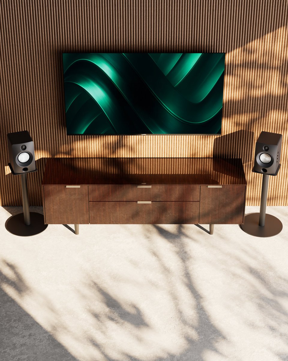 LumioIN's tweet photo. Most "home audio" today is a soundbar. One box, pretending to be stereo.
Lumio Aura 5 is the real thing. Two speakers. Wooden cabinets. Proper Hi-Fi sound. And a setup that takes about two minutes.
It's our first home audio product, and we can't wait for you to hear it.
Here's what you get.
Simple: everything's built in
Aura 5 is a complete, powered stereo pair. The amplifier and DAC are already inside, so there's no receiver to buy and no pile of components to figure out.
Connect the two speakers. Plug in the power. Connect your source. Done.
Fidelity: two speakers, real stereo
Each speaker has its own dual-driver setup: a 4.5-inch aluminium woofer for the lows and mids, a 1-inch silk dome tweeter for the highs, and a front-facing bass port.
Because the left and right speakers sit apart, vocals land in the centre and instruments spread across the room. That sense of space is what a soundbar can't give you, and it's what Hi-Fi is really about.
There's plenty of power behind it. 100W sustained, 200W peak, reaching 105dB SPL at one metre. Loud enough to fill a large living room without straining. Bass reaches down to 35Hz at 80dB, so kick drums hit and movie scenes rumble, without a separate subwoofer.
We also cared about the parts you'll never see. Aura 5 plays lossless audio up to 24-bit/48kHz, and the DAC runs on its own isolated, low-noise power supply.
Tuned with our community
Sound is personal, so we shaped our DGS tuning together with Lumio's community of enthusiasts.
Pick the mode that fits what you're playing:
Studio: balanced, for everyday listening.
Cinema: clearer dialogue and more atmospheric detail.
Groove: extra bass for the high-energy playlists.
Versatile: connects to everything
Seven input modes: HDMI ARC, optical, coaxial, 3.5mm, Bluetooth 5.4, and USB with separate PC and playback modes.
Under your TV for movie night. On your desk while you work. And when a friend wants to play one song, they just pair their phone.
The Minion OLED Bluetooth remote handles volume, inputs and listening modes from your couch. An Android and iOS app is coming soon.
Service that comes to you
Home service across India, backed by 300+ service centres. Plus a one-year comprehensive warranty on the speaker pair and six months on the remote.
Price and availability
Lumio Aura 5 goes on sale soon on Amazon and Lumio Store.
Early bird price: ₹19,999
Regular price: ₹24,999
Your audiophile journey starts here.