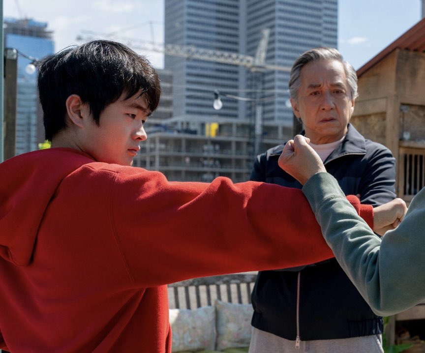 Dimson001789's tweet photo. Karate Kid: Legends (2025) ⭐️⭐️⭐️⭐️⭐️

KARATE KID: LEGENDS ISN’T REALLY ABOUT LI FONG LEARNING TO FIGHT. IT’S ABOUT HIM LEARNING THAT HE DOESN’T HAVE TO RUN FROM WHO HE IS.

Li Fong starts the movie trying to leave kung fu behind. After losing his brother, his mother wants him away from fighting, and Li starts believing that the safest way to move forward is to bury the part of himself that made him a fighter in the first place.

But New York keeps pulling that part of him back out.

The interesting thing is that Mr. Han and Daniel LaRusso aren’t really teaching Li how to become someone new. They’re teaching him how to combine what he already has. Mr. Han gives him kung fu. Daniel gives him Miyagi-Do. Li becomes strongest when he stops choosing between the two.

And that makes the title “Legends” more meaningful than just bringing Jackie Chan and Ralph Macchio together.

Daniel is carrying Mr. Miyagi’s legacy. Mr. Han is carrying his own family’s martial-arts tradition. Now Li becomes the person who connects those worlds.

The movie is basically saying that legacy isn’t about copying your teacher.

It’s about taking what they gave you and becoming something they never could have been.

And honestly, Li’s biggest enemy was never Connor.

It was the belief that fighting automatically meant becoming the person he was afraid of becoming.

Do you think Li became a better fighter because of Daniel and Mr. Han or because they finally taught him to trust the fighter he already was?