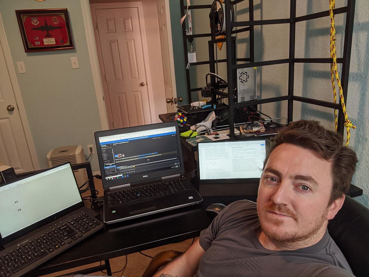 NanoracksSpace's tweet photo. The #Nanoracks team is hard at work (from home) to keep your dreams in space strong. Now featuring those dusty old college textbooks, extra monitors, and most importantly: #puppies https://t.co/Fi6bXOASbc