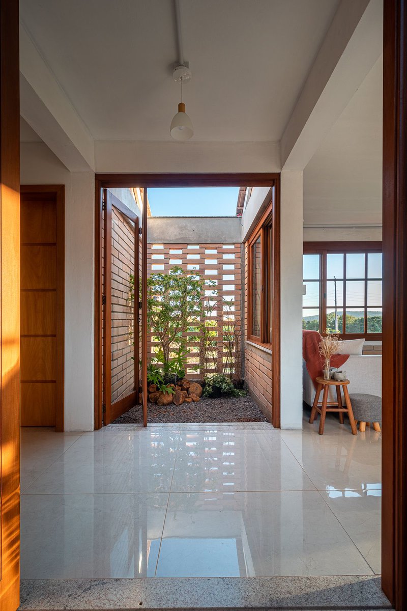 shavnyuyngah's tweet photo. You've been asking me for cost-friendly home and bungalow ideas, especially across Africa. Before I answer, I need to understand something: what's actually stopping you where you are?

Is brick not available or affordable in your region? Is it labor, nobody nearby who can lay it well? Or have you just never seen a house built this way, so it's never felt like a real option?

Here's why I'm asking. This is a brick bungalow in Brazil, built under a government low-income housing program, already move-in ready with no plastering needed. LEIVA arquitetura built this 75 sqm home in Tupandi for a family on a strict budget. Exposed gray brick handles the walls, floors are finished, electrical conduit and concrete structure are left visible on purpose. Nothing extra to add before move-in.

Most of us build the opposite way. A house goes up, and the money for plastering, painting, and tiling was never actually budgeted from day one. So it sits half-finished for years while the family scrambles to fund the rest.

Drop your country and what's actually stopping you. I'm collecting this to find the right material producers to work with.