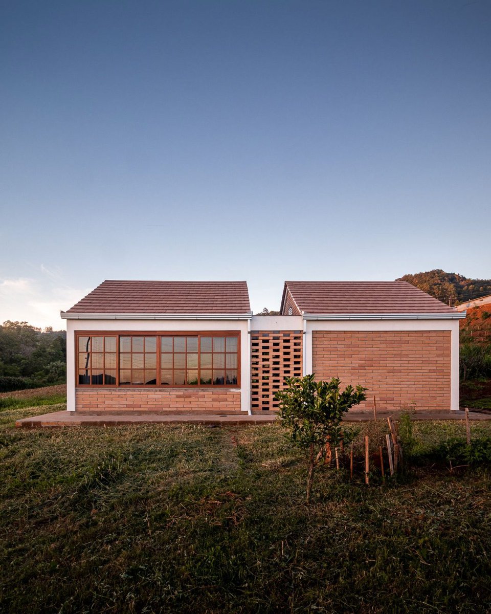 shavnyuyngah's tweet photo. You've been asking me for cost-friendly home and bungalow ideas, especially across Africa. Before I answer, I need to understand something: what's actually stopping you where you are?

Is brick not available or affordable in your region? Is it labor, nobody nearby who can lay it well? Or have you just never seen a house built this way, so it's never felt like a real option?

Here's why I'm asking. This is a brick bungalow in Brazil, built under a government low-income housing program, already move-in ready with no plastering needed. LEIVA arquitetura built this 75 sqm home in Tupandi for a family on a strict budget. Exposed gray brick handles the walls, floors are finished, electrical conduit and concrete structure are left visible on purpose. Nothing extra to add before move-in.

Most of us build the opposite way. A house goes up, and the money for plastering, painting, and tiling was never actually budgeted from day one. So it sits half-finished for years while the family scrambles to fund the rest.

Drop your country and what's actually stopping you. I'm collecting this to find the right material producers to work with.