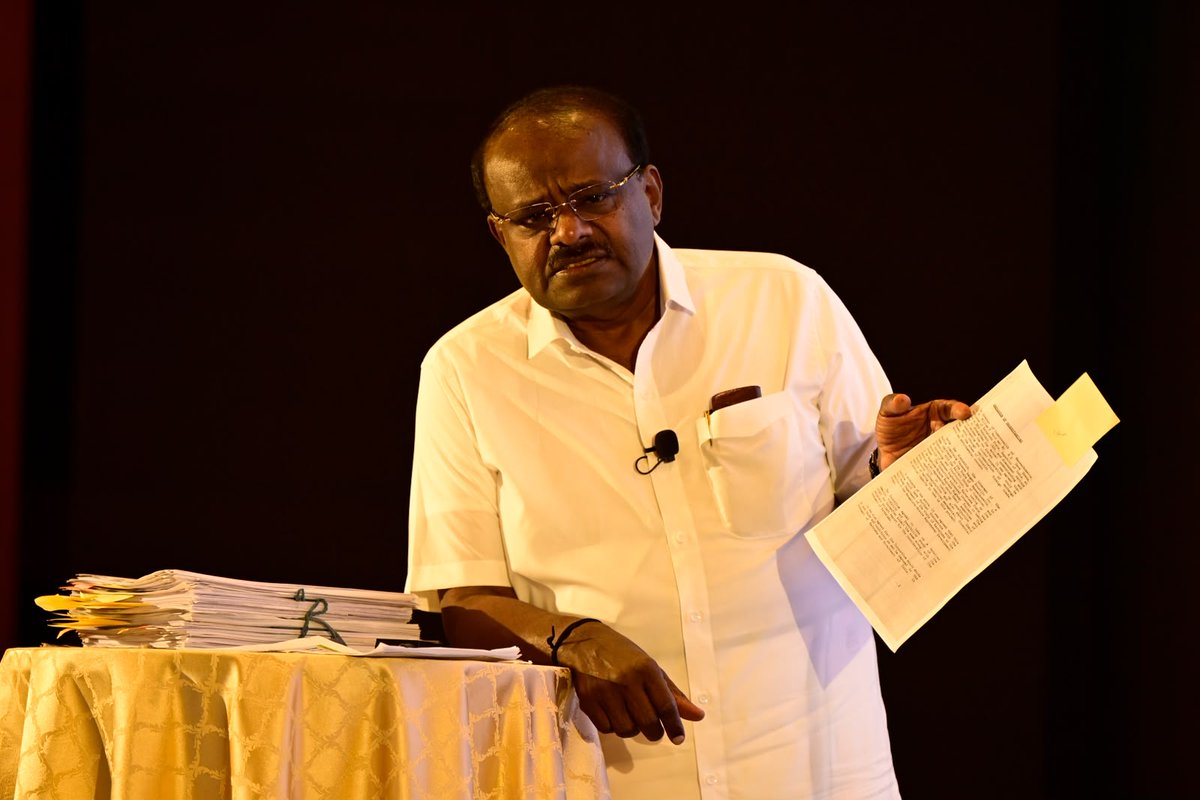 the_hindu's tweet photo. The rivalry between #Karnataka Chief Minister D.K. Shivakumar and Union Minister H.D. Kumaraswamy took a new turn. The Union Minister – releasing documents on Bangalore-Mysore Infrastructure Corridor Project – accused the CM of taking decisions in 2004 as Urban Development Minister and Chairman of BMICP Authority that were in violation of original framework agreement. 

He alleged that the current wealth of over Rs. 1,400 crores of Mr. Shivakumar basically comes from manipulation and fraud committed in NICE scam. Mr. Kumaraswamy released documents of "illegal land purchases" by Mr. Shivakumar, his brother D.K. Suresh and other family members, and alleged the total land in their possession to be over 150 acres. These lands were notified for the project, which cannot be sold/bought/ mortgaged.

- @srivatsasharath reports
📸 @JainSudhakara