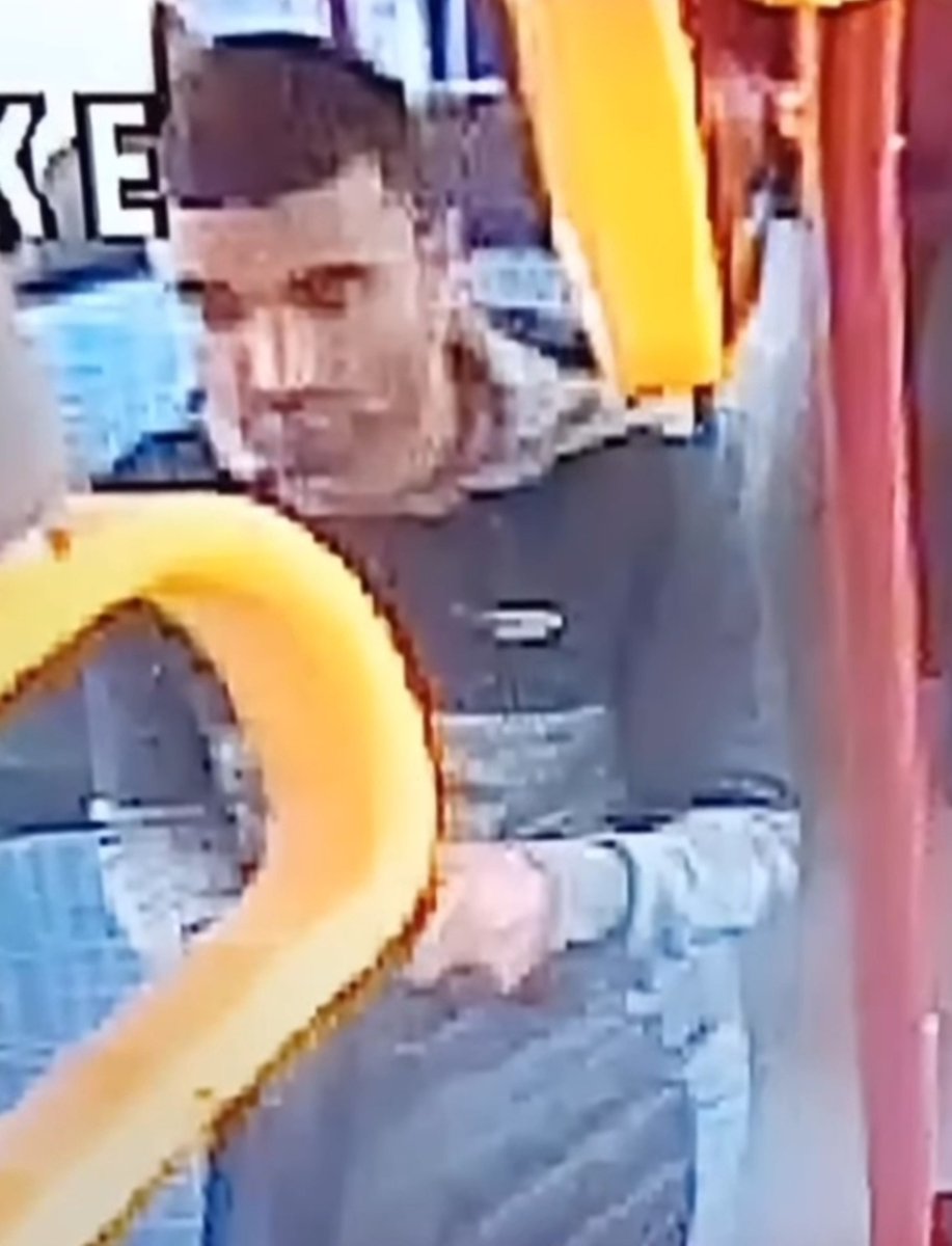 SnDMediaNews's tweet photo. Gardaí Release Bus CCTV In Appeal After Alleged Assault On Waterford To Tramore Service

Gardaí are asking the public to help identify a man captured on CCTV aboard a bus travelling between Waterford and Tramore after an alleged assault on a young girl.

The still, which appears to have been circulated as part of a public appeal, shows a man standing inside a bus with distinctive yellow handrails. He has short dark hair and a short beard, and is wearing a grey hooded top with darker panels and a small badge on the chest. He is holding a grey bag.

Officers have not publicly released a full official statement matching every detail of the clip in readily available reports, but the image is being shared in connection with an alleged assault said to have taken place on the Waterford–Tramore route and recently featured on crimecall.

Anyone who recognises the man, was a passenger on the service, or has further footage is being urged to come forward. Gardaí treat assaults on children and young people as a priority and are appealing for witnesses rather than asking the public to approach anyone they believe may be the person in the image. We have tweaked the image for better clarity, it may help identify the suspect.

Anyone with information should contact Tramore Garda Station on (051) 391620, Waterford Garda Station on (051) 305300, the Garda Confidential Line on 1800 666 111, or any Garda station.
