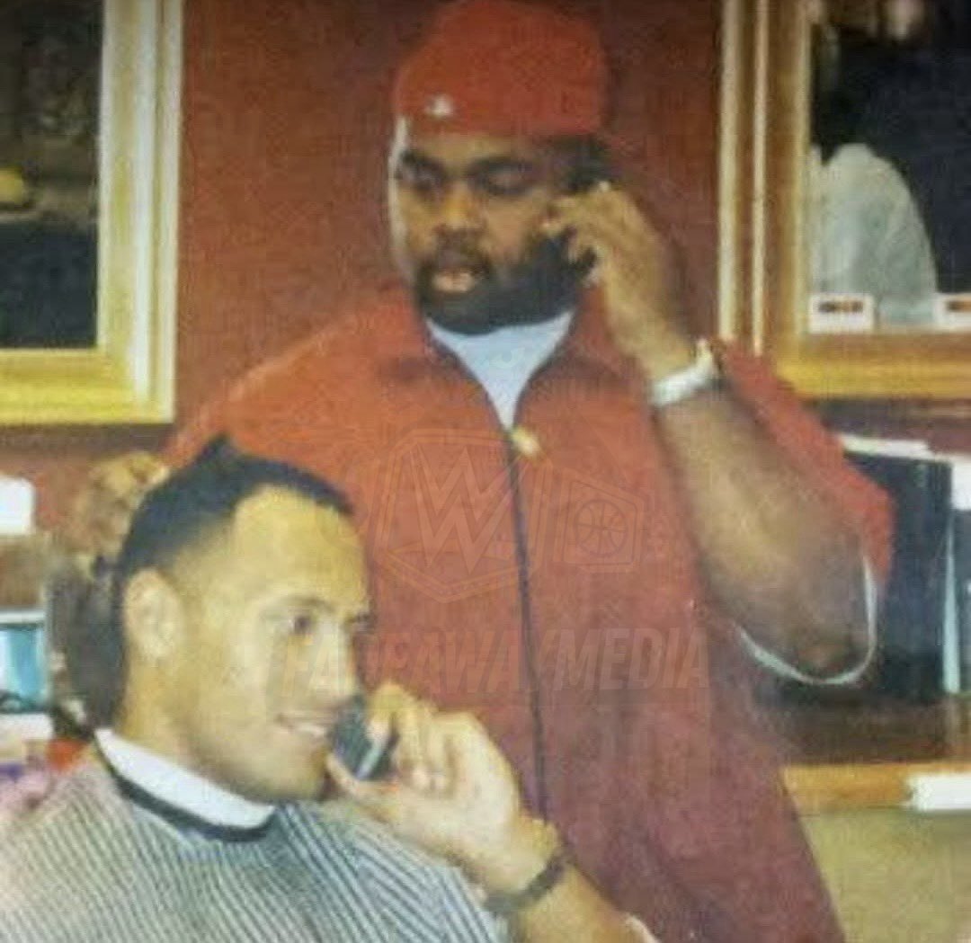 FadeAwayMedia's tweet photo. RARE photo of a young Rock getting his haircut by a local barber before a WWE show 🔥 https://t.co/G0g17ieqlF