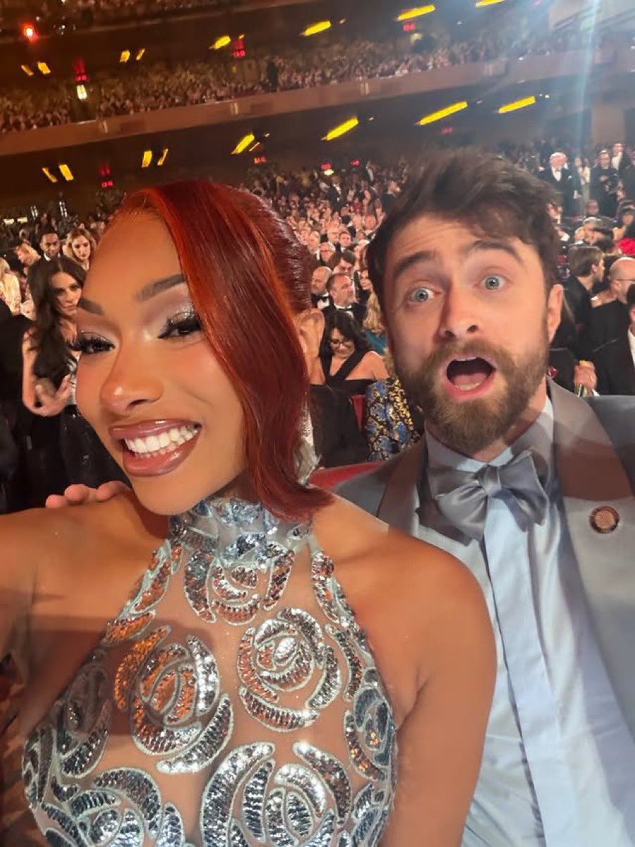 MegansStats's tweet photo. Megan Thee Stallion talks about working either Daniel Radcliffe while filming ‘Reggie Dinkins’:

— “‘Megan clearly knows how to find the right work families. She gushes about the entire cast of Reggie Dinkins, especially her primary scene partner, Radcliffe. “I was on that set, calling that man Harry Potter all day,” she exclaims. He clearly took it in stride. “Daniel made me feel so, so, so comfortable. We were literally talking and joking the whole time. I think that’s why the chemistry was so good.’”