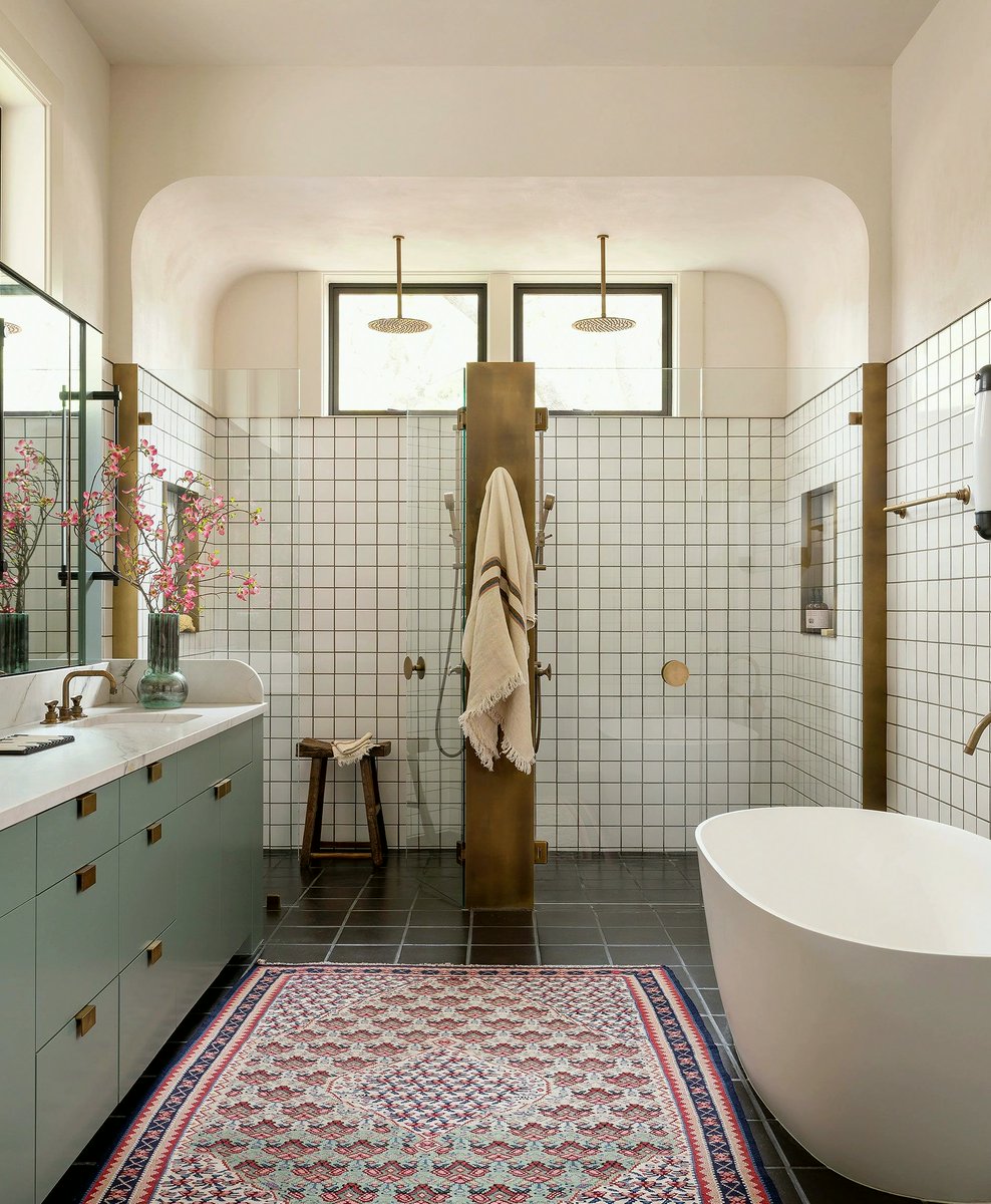 coopermichsvw's tweet photo. Bathroom with two separate shower niches accented by aged-brass fixtures in a modern ranch-style house, Zilker, Austin, Texas [2057x2500] https://t.co/yQTLh20fx2