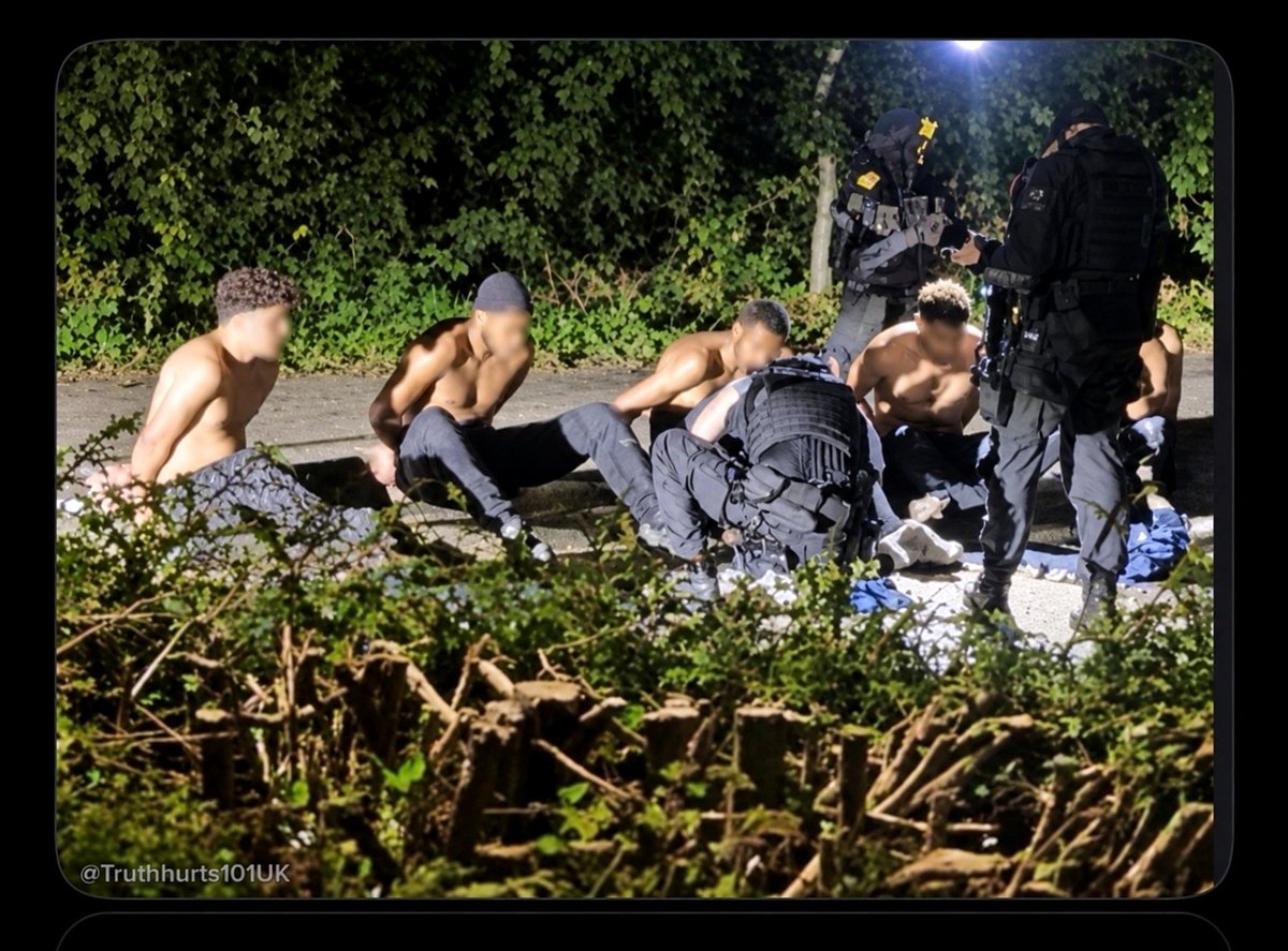 SamEagleForge's tweet photo. @EricLDaugh A photograph of the five people detained by the UK government and then released yesterday. Look closely. You can clearly see that they are not from the UK. They're military-age males and they appear to be Islamist. When you look at the UK version of the photo you cant see that. https://t.co/eJrFYvbLT2