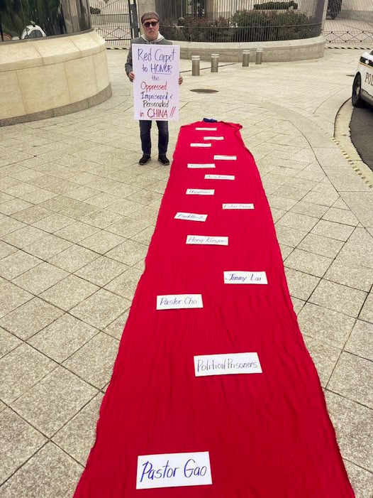 revmahoney's tweet photo. Sadly, Chinese President Xi received "Red Carpet" treatment when he visited Washington, DC. It was deeply troubling to see a brutal leader who violently oppresses his own people be honored and celebrated in such a way by the United States government.

On September 28, we went to the public sidewalk in front of the Chinese Embassy in Washington, DC and laid out a "Red Carpet" with the names of people and groups who were being persecuted and punished by President Xi to honor, pray and stand in solidarity with them.

Moments later Chinese Embassy officials asked the Secret Service to arrest me, which they did. Brothers and sisters how is it possible the United States Secret Service arrested an American minister for peacefully praying on the public sidewalk!  #WeAreNotChina #ProtectFreeSpeech #ProtectReligiousFreedom #AmericaDoBetter @SolomonYue @GordonGChang @mercedesschlapp @hk_watch @hkfp @hkdc_us @Stand_with_HK @frances_hui @CPAC