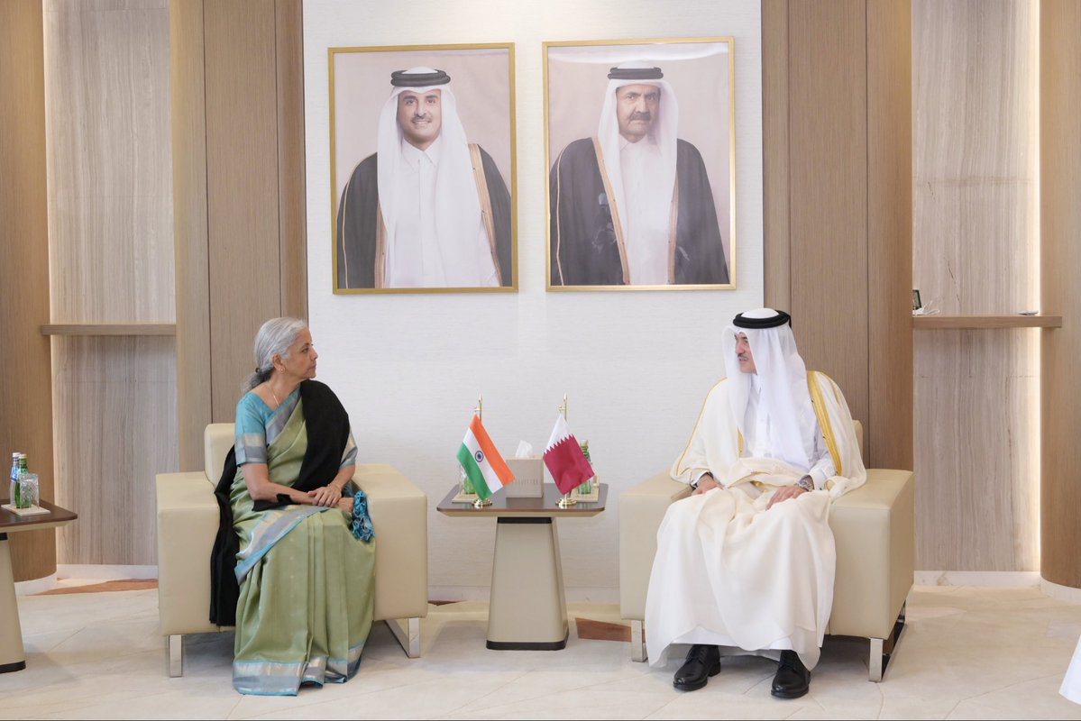 FinMinIndia's tweet photo. Union Minister for Finance & Corporate Affairs Smt. @nsitharaman met Dr. Ahmad bin Mohammed Al-Sayed, Qatar Minister of State for Foreign Trade @MOCIQatar, on the sidelines of the AIIB 2026 Annual Meeting in Doha, Qatar, today.

Dr. Ahmad bin Mohammed Al-Sayed warmly recalled his visit to India in 2025 and observed that there was considerable scope for investment in India in several infrastructure sectors including ports, airports, highways and power, and opportunities for Indian companies to invest in Qatar in areas including food security, pharmaceuticals, petrochemicals, education, health and start-ups.

FM Smt. @nsitharaman conveyed that India attaches high importance to enhancing trade and investment with Qatar, noting the elevation of bilateral ties to a “strategic partnership” during the State Visit of H.H. the Amir of Qatar in February 2025. She highlighted trade and investment as important pillars for adding strategic dimensions to the relationship.

The Union Finance Minister emphasised the importance of restoring normal trade between India and Qatar and other Gulf countries, including unimpeded maritime navigation and commerce through the Strait of Hormuz.

They also discussed the implementation of the $10 billion Qatari investment commitment and establishment of a QIA office in India. They both expressed keen interest in completing the Bilateral Investment Treaty with Qatar, for which they decided on accelerated engagement, as well as the Free Trade Agreement (FTA) negotiations.